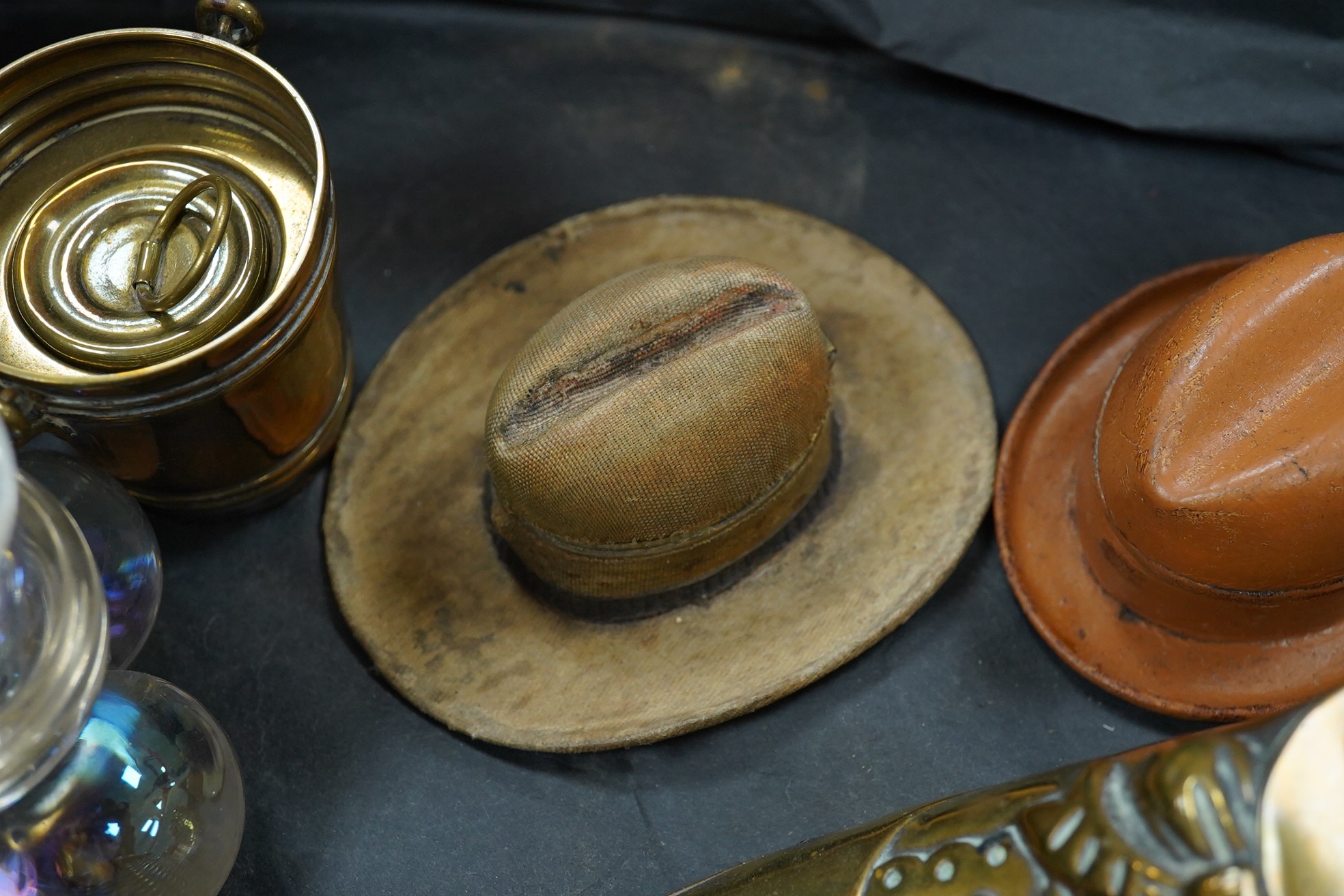 Twelve various novelty inkwells, to include two gentlemen’s hats, a coal scuttle, a brass shoe, etc., largest shoe 12.5cm long. Condition - fair to good